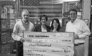 In May, Mark Witzel (l), chapter president, and Marty Paulsen (r), chapter vice president for education, present $1,000 to Rancho Buena Vista High School Principal Varda Levy (2nd from l) and Kellie Wright for the Science Teaching Tools Award.